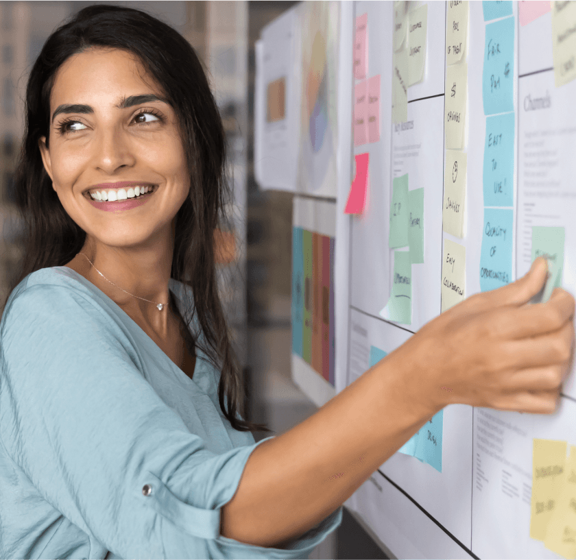 A smiling woman in a professional setting, representing key product features of OneTouch software